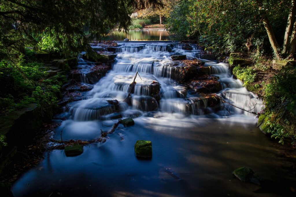 Long exposure of Carshalton Ponds Waterfall in Grove Park, Sutton, London, England